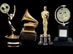 Emmy Award, Grammy Award, Oscar Award, and Tony Award on black background
