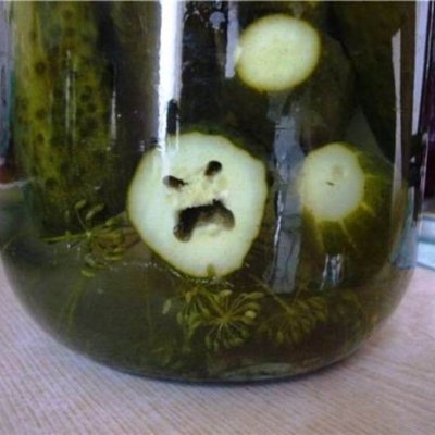 Pickle in jar with creepy face